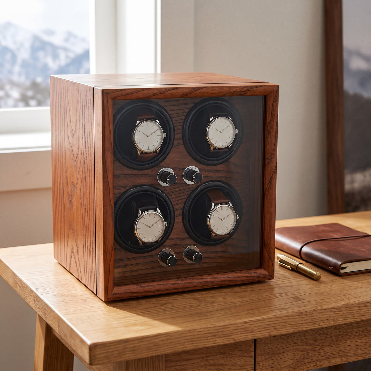 Remontoir 4 montres Platine sur un bureau en chêne face à la montagne